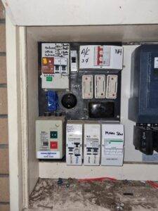 Outdated and unsafe electrical switchboard with old fuses