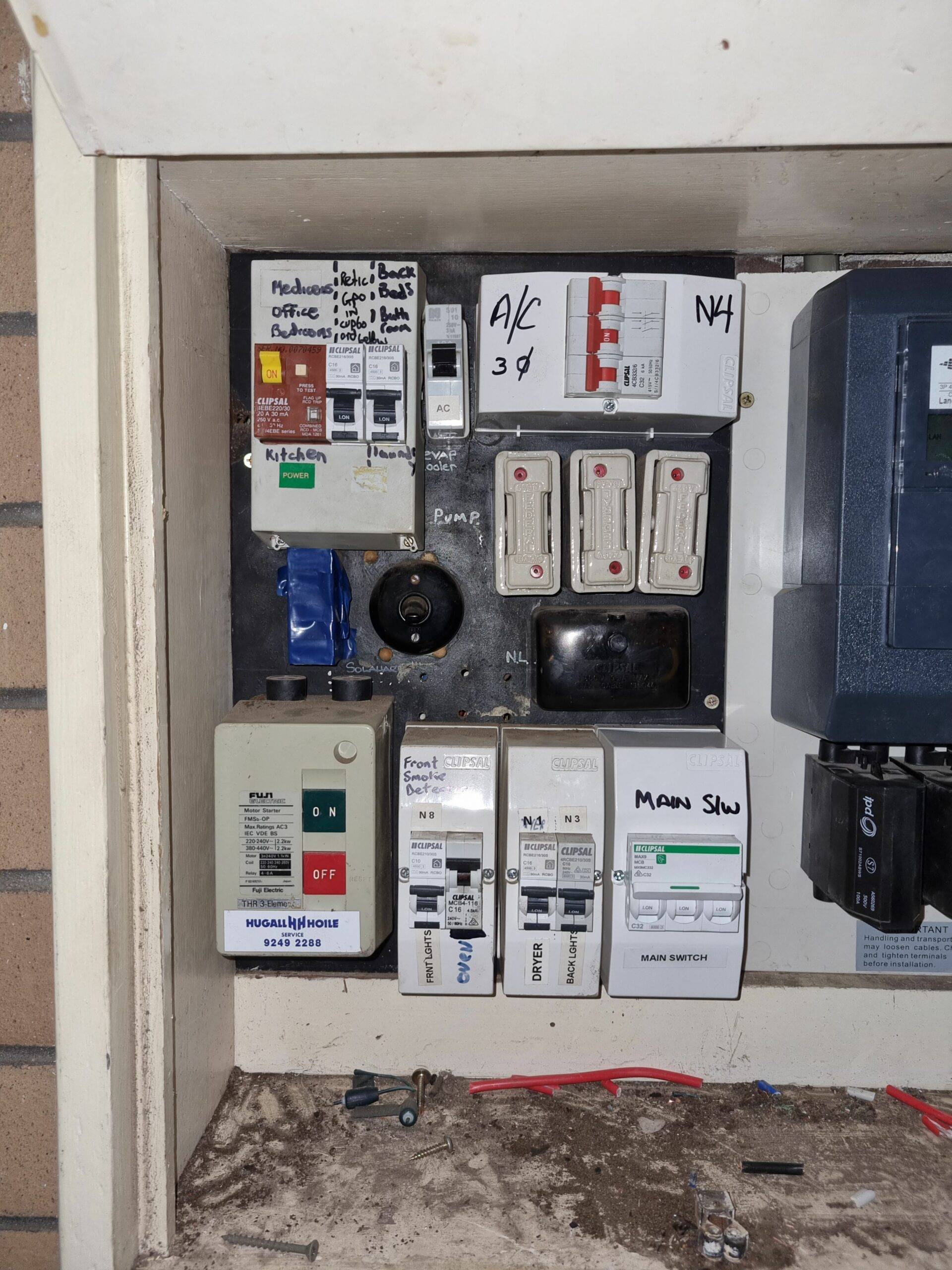 Outdated and unsafe electrical switchboard with old fuses
